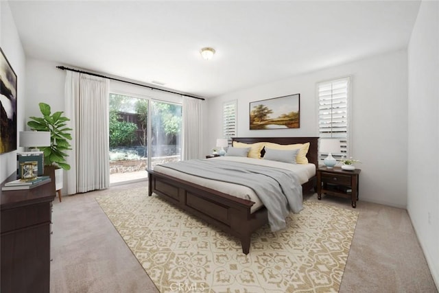 carpeted bedroom with access to exterior