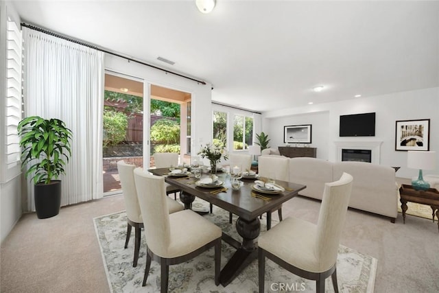 view of carpeted dining area