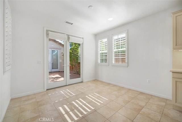 interior space with light tile patterned floors