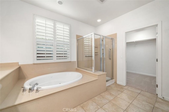 bathroom featuring separate shower and tub and tile patterned flooring