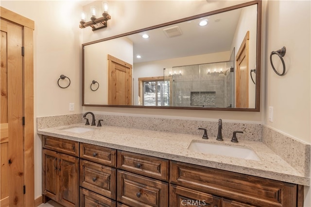 bathroom featuring walk in shower and vanity