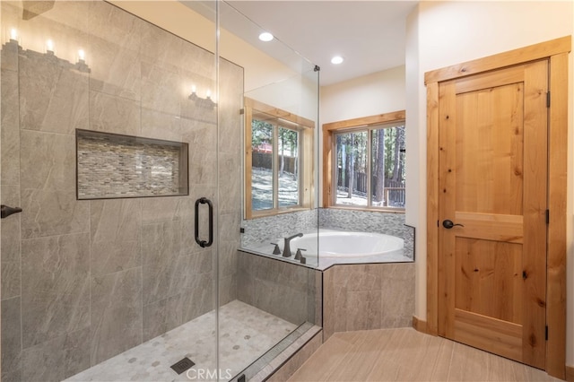 bathroom featuring plus walk in shower