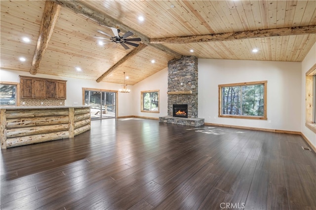 unfurnished living room with a stone fireplace, hardwood / wood-style floors, and wooden ceiling