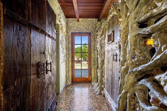 misc room featuring wood ceiling and beam ceiling