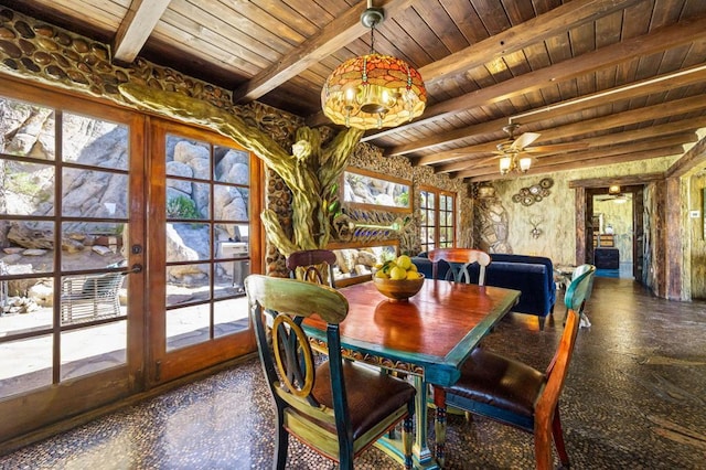 dining space featuring ceiling fan, beamed ceiling, wooden ceiling, and french doors