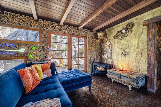 living area with beamed ceiling, a wood stove, and wooden ceiling