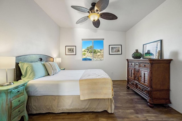 bedroom featuring vaulted ceiling, ceiling fan, and dark wood-type flooring