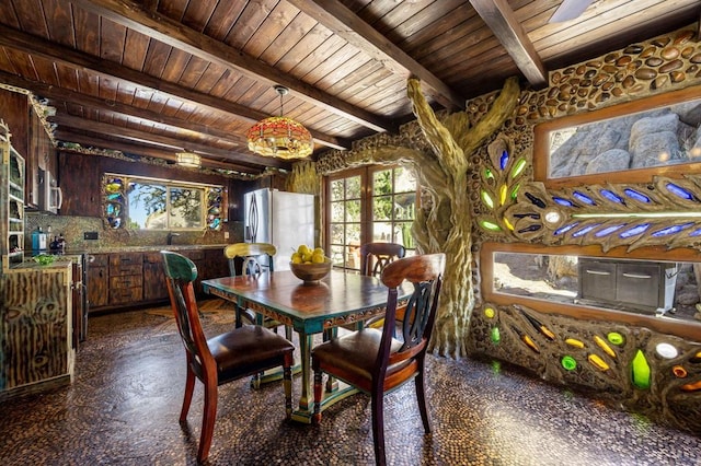 dining space with beamed ceiling, wood ceiling, and sink