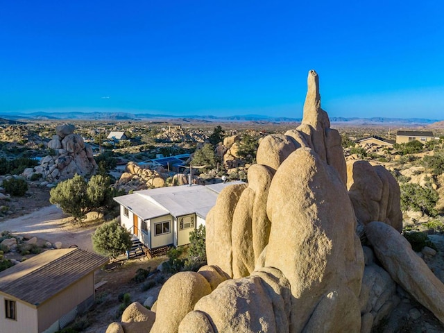 birds eye view of property with a mountain view