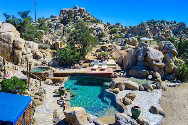 view of swimming pool with a patio