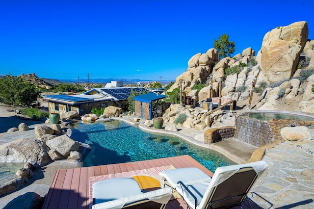 view of swimming pool with a patio area