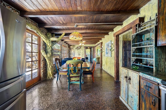 dining space featuring beamed ceiling and wooden ceiling