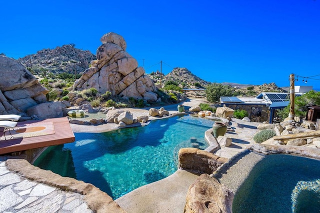 view of swimming pool featuring a mountain view