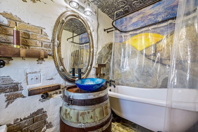 details with a tub to relax in and vanity