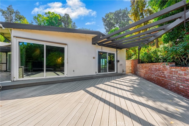 wooden deck featuring a pergola