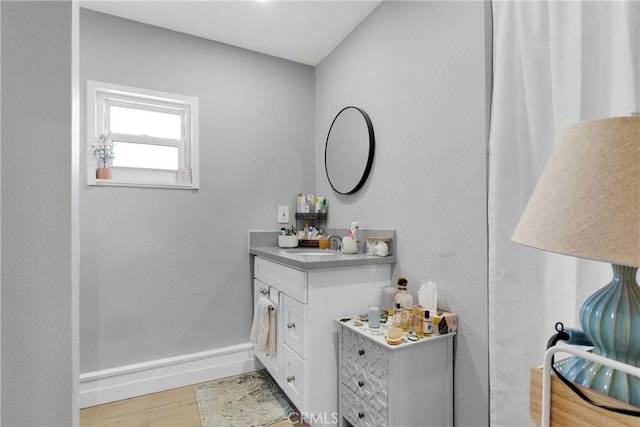 bathroom with vanity and hardwood / wood-style flooring