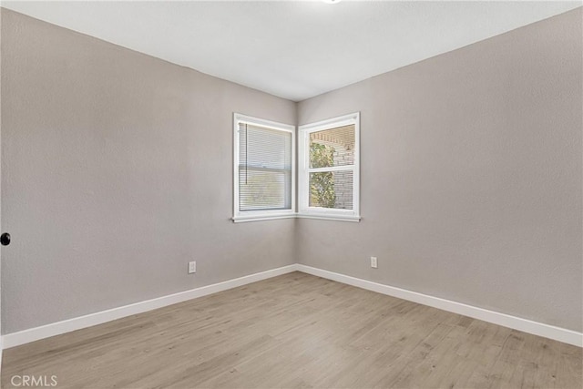 empty room with light wood-type flooring