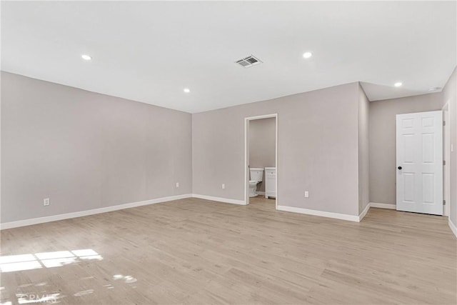 unfurnished room featuring light hardwood / wood-style floors