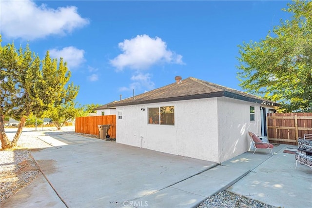 view of property exterior featuring a patio