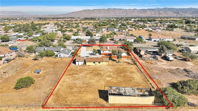 birds eye view of property featuring a mountain view