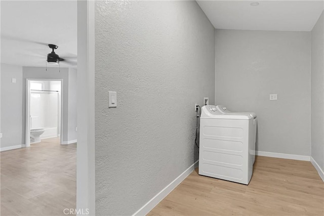 clothes washing area with ceiling fan, light hardwood / wood-style floors, and separate washer and dryer