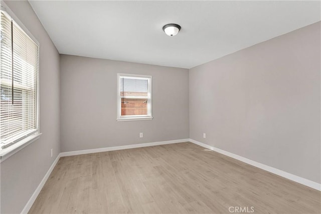 unfurnished room with light hardwood / wood-style flooring