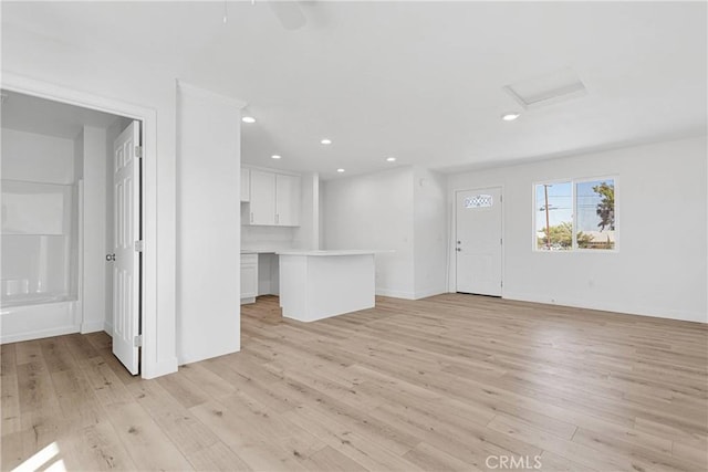 unfurnished living room featuring light wood-type flooring