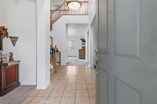 foyer featuring light tile patterned floors