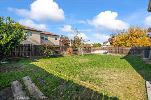 view of yard featuring central AC unit