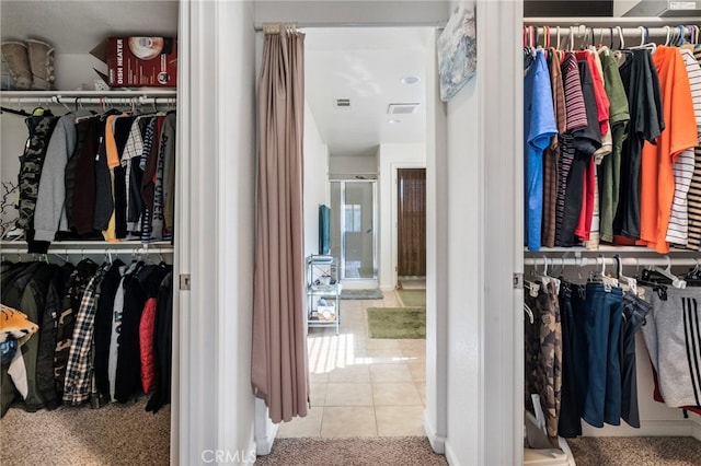 walk in closet featuring tile patterned floors