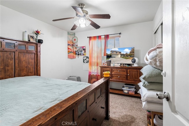 bedroom with ceiling fan and light colored carpet