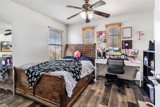 bedroom with ceiling fan and dark hardwood / wood-style floors