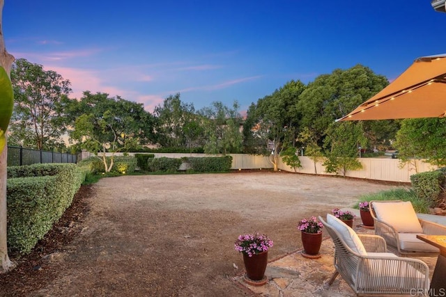 view of property's community with a patio area and a fenced backyard