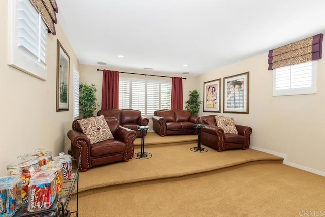 living area with carpet, baseboards, and recessed lighting