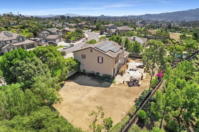 aerial view featuring a mountain view and a residential view