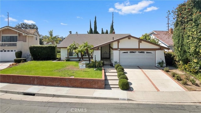 view of front facade featuring a front yard and a garage