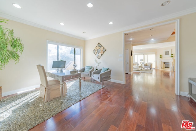 living room featuring dark hardwood / wood-style floors and ornamental molding