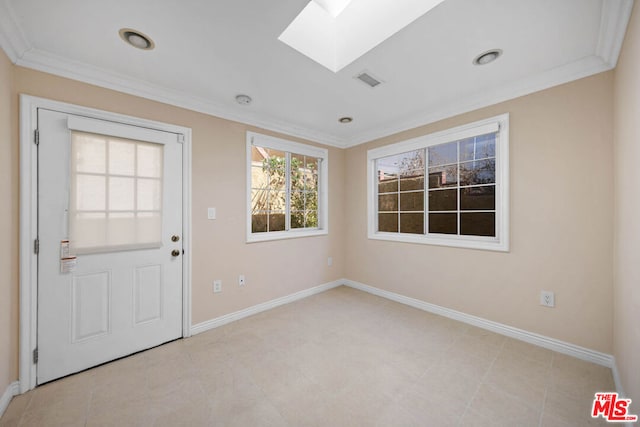 unfurnished room with a skylight and ornamental molding