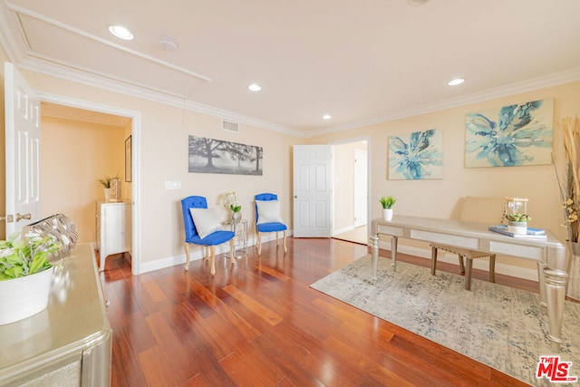 sitting room featuring dark hardwood / wood-style flooring and ornamental molding