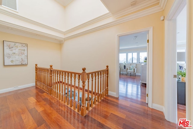 corridor with crown molding and hardwood / wood-style flooring