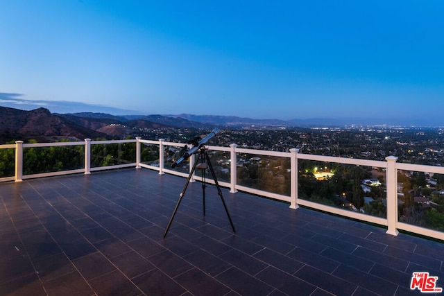 view of patio / terrace with a mountain view