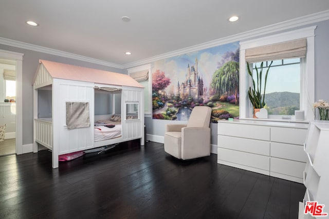 bedroom featuring multiple windows, ornamental molding, dark wood-type flooring, and a mountain view