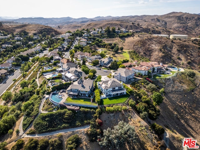 drone / aerial view featuring a mountain view