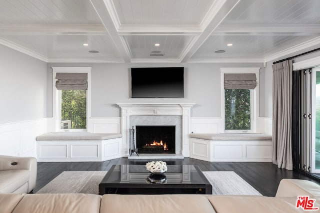 living room featuring coffered ceiling, dark hardwood / wood-style floors, beamed ceiling, and a premium fireplace