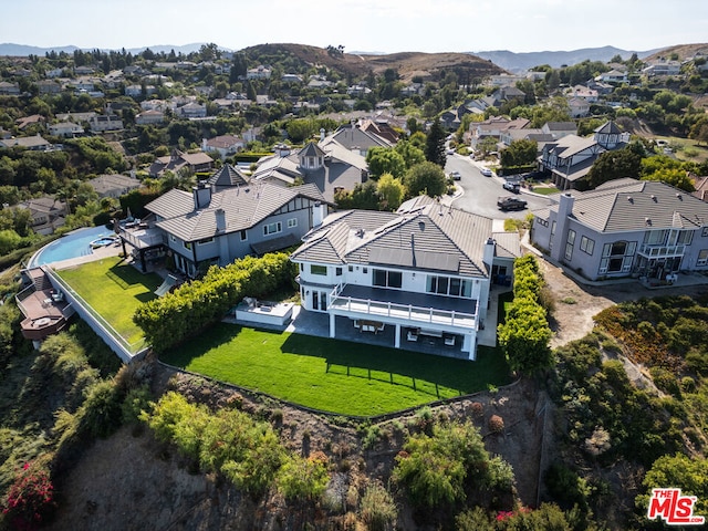 drone / aerial view featuring a mountain view