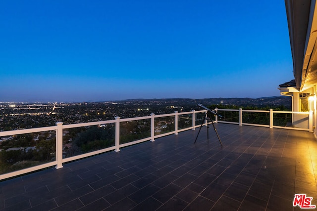 patio terrace at dusk with a balcony