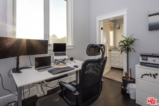 office space with dark wood-type flooring