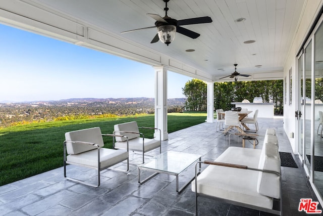 view of patio with ceiling fan