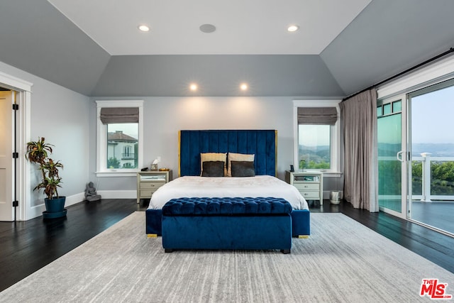 bedroom featuring access to outside, lofted ceiling, and dark hardwood / wood-style flooring