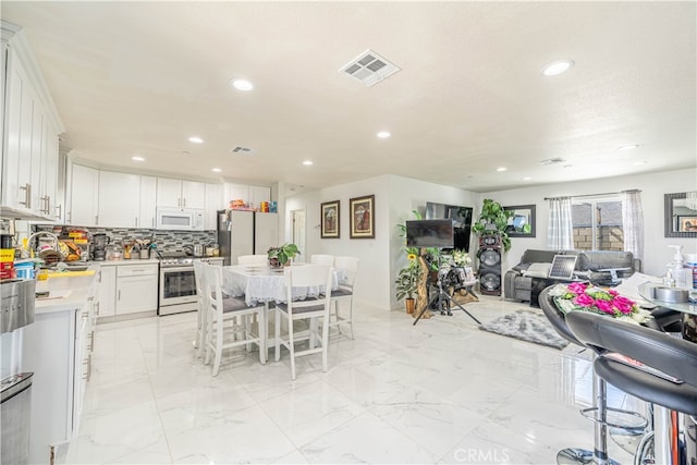 dining area featuring sink